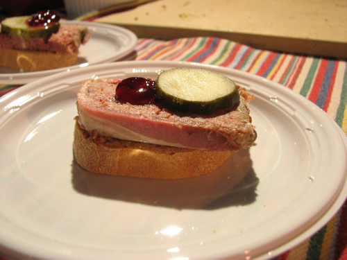 Rosemary pate from EVOO, topped with Concord Grape jelly and a pickle.